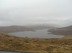View of Toftir Lake (Toftavatn) on a misty day